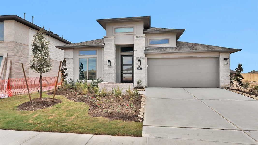 Front exterior of a new home in Bridgeland, Cypress, TX, highlighting curb appeal (Image 2).