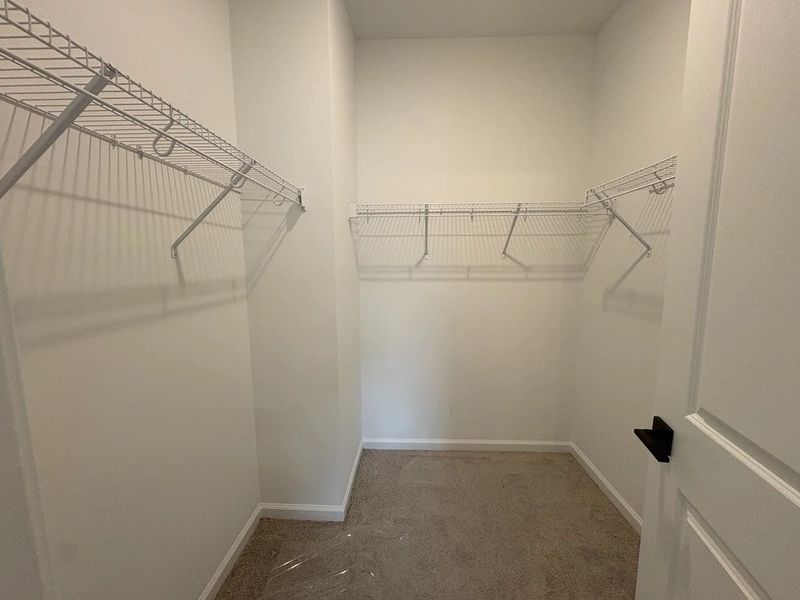 Primary Walk-In Closet featuring AW Collection® Oxford - Spacious simplicity designed for ease. Primary Walk-In Closet featuring AW Collection® Oxford - Spacious simplicity designed for ease.