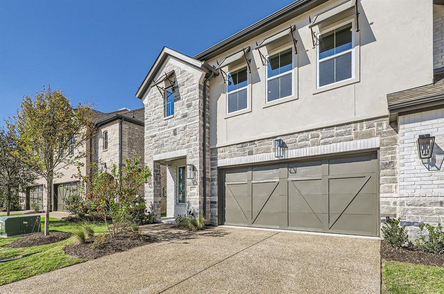 View of front facade featuring a garage