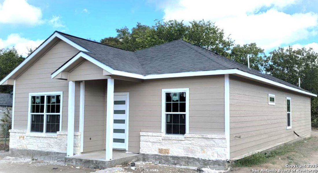 Front exterior of a new home in , San Antonio, TX, highlighting curb appeal (Image 1).
