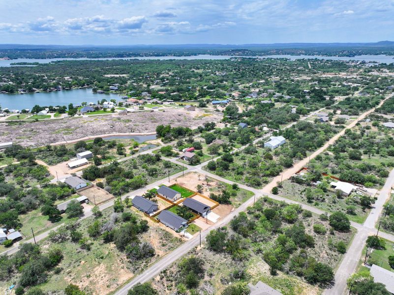 Aerial view of property's location featuring property parcel outlined and a large body of water