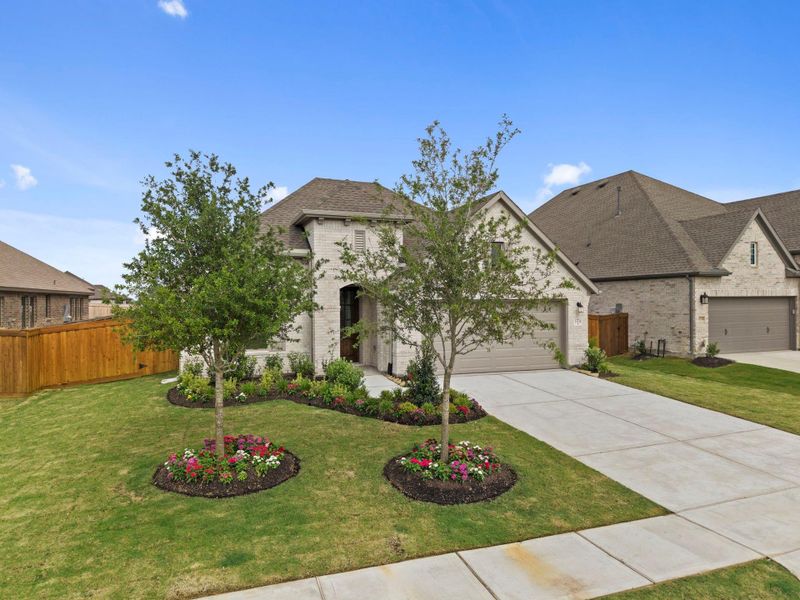 Front exterior of a new home in Dunham Pointe, Cypress, TX, highlighting curb appeal (Image 21).