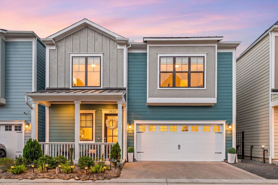 Front exterior of a new home in Timbergrove Trails, Houston, TX, highlighting curb appeal (Image 22).
