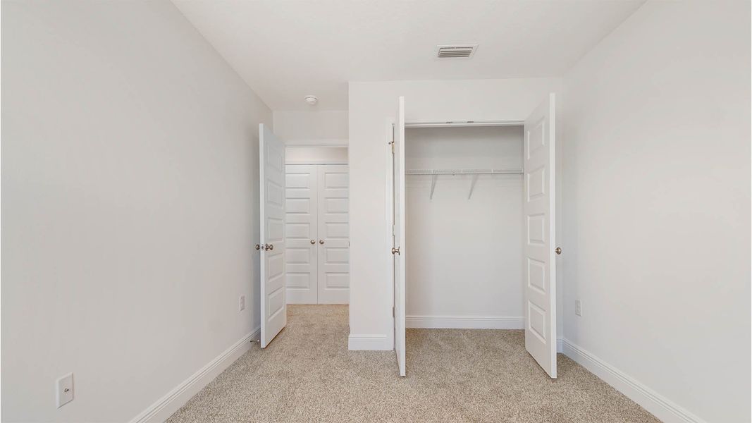 Spacious, unfurnished interior of a new home in Bayside at Ward Creek, Panama City Beach (Image 31).
