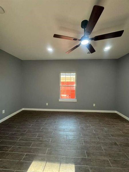 Unfurnished room with recessed lighting and wood tiled floors