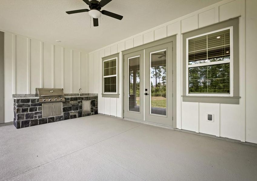 Being your cooking outdoors with the covered outdoor kitchen.