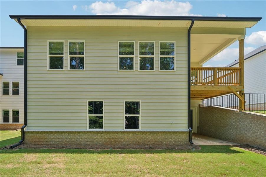 Front exterior of a new home in Martin Springs - Estate Series, Lawrenceville, GA, highlighting curb appeal (Image 21). Front exterior of a new home in Martin Springs - Estate Series, Lawrenceville, GA, highlighting curb appeal (Image 21).