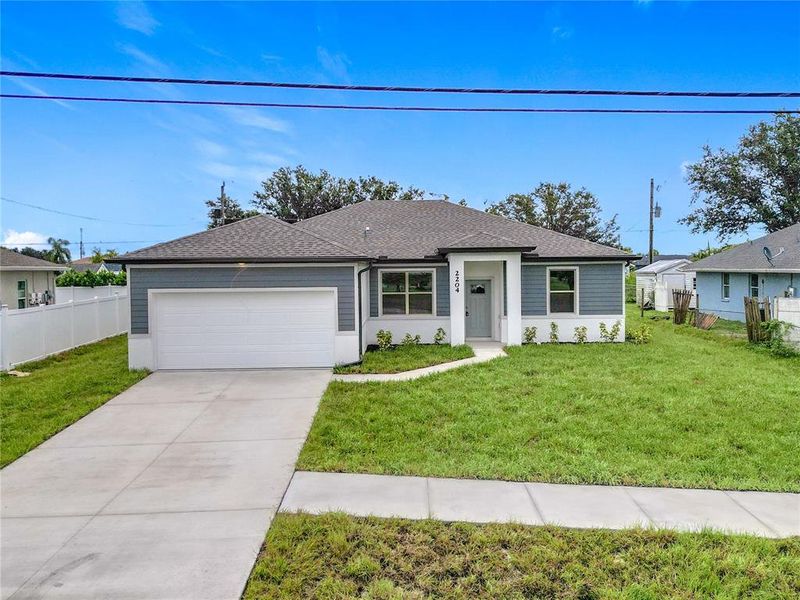 Front exterior of a new home in , North Port, FL, highlighting curb appeal (Image 25).