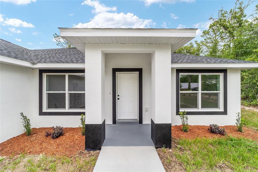 Front exterior of a new home in , Dunnellon, FL, highlighting curb appeal (Image 1). Front exterior of a new home in , Dunnellon, FL, highlighting curb appeal (Image 1).