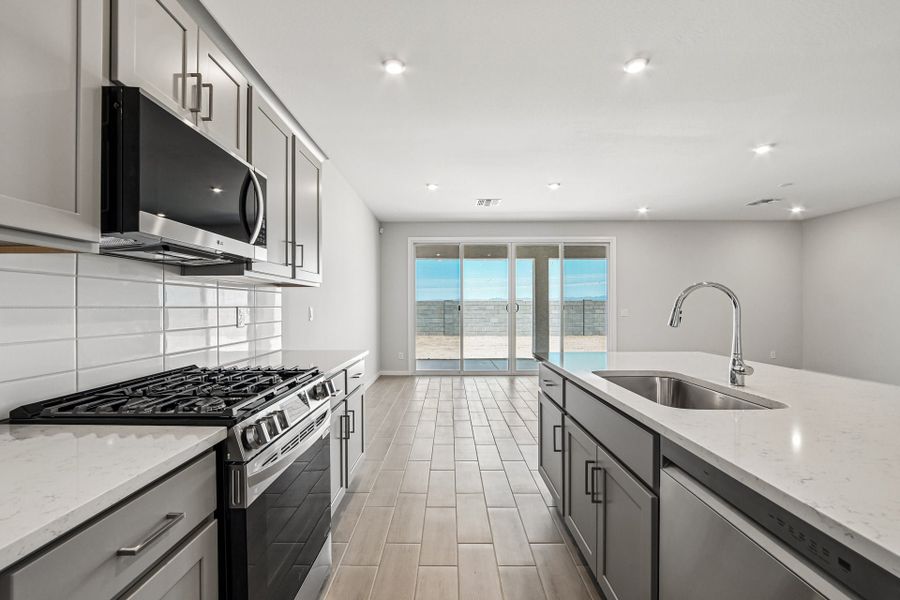 A kitchen with a tile floor.