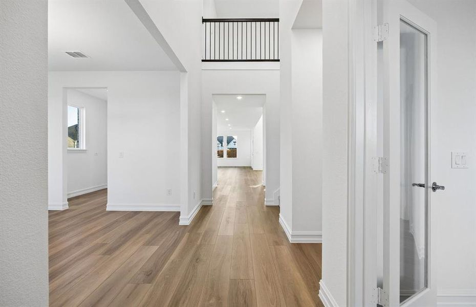 Welcoming entry into home with soaring ceilings Welcoming entry into home with soaring ceilings