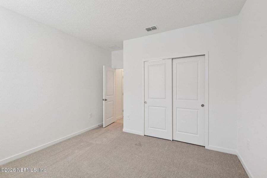 Spacious, unfurnished interior of a new home in Lakes at Bella Lago - Signature Series, Green Cove Springs (Image 24).