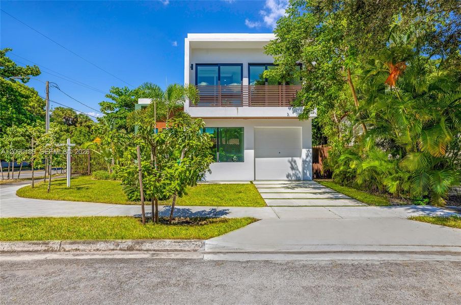 Front exterior of a new home in , Miami, FL, highlighting curb appeal (Image 1). Front exterior of a new home in , Miami, FL, highlighting curb appeal (Image 1).