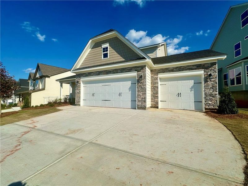Front exterior of a new home in Twin Lakes, Hoschton, GA, highlighting curb appeal (Image 21).