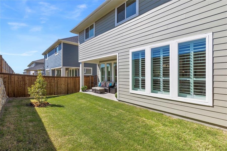 Exterior details and patio area of a home in North Square at Uptown, Celina (Image 4).
