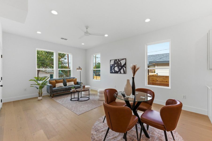 Dining space featuring light wood-type flooring, recessed lighting, and a ceiling fan