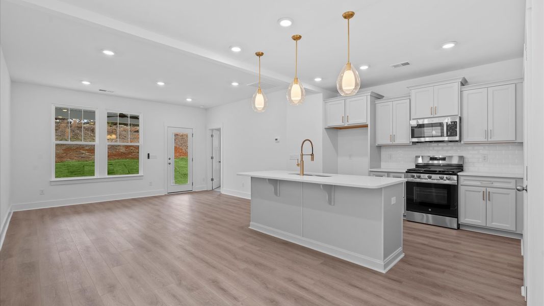 Superior craftsmanship shines in this modern kitchen with a space-saving island and open flow in Moore, SC