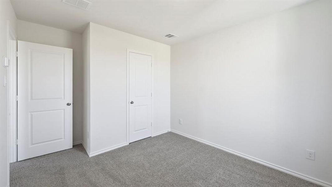 Unfurnished bedroom featuring carpet and baseboards Unfurnished bedroom featuring carpet and baseboards