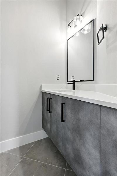 Bathroom with vanity and concrete floors