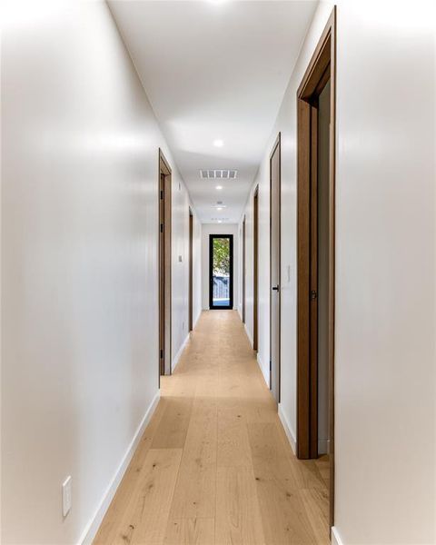 Upstairs corridor featuring 9.5" wood plank floors.