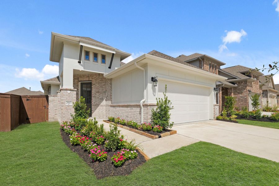 Front exterior of a new home in The Trails, New Caney, TX, highlighting curb appeal (Image 1). Front exterior of a new home in The Trails, New Caney, TX, highlighting curb appeal (Image 1).