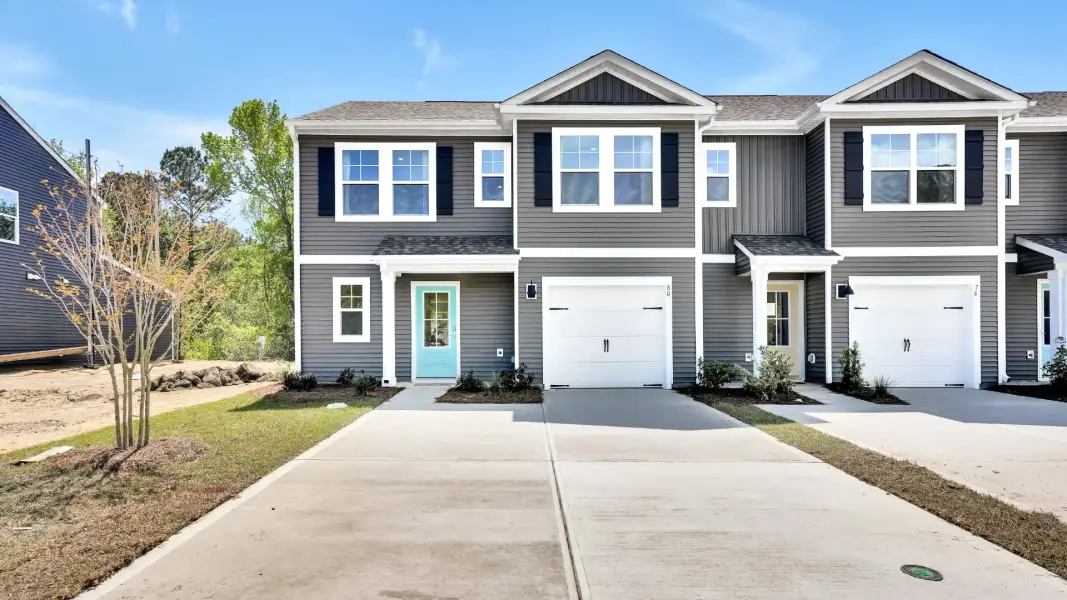 Representative exterior photo of a completed home built from the Norman Th by D.R. Horton in The Willows at Blake Farm EXP, Wilmington, NC (Image 1). Representative exterior photo of a completed home built from the Norman Th by D.R. Horton in The Willows at Blake Farm EXP, Wilmington, NC (Image 1).