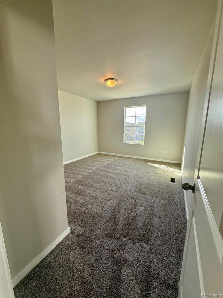 Spacious, unfurnished interior of a new home in Sky Ranch – Uptown Collection, Watkins (Image 18).