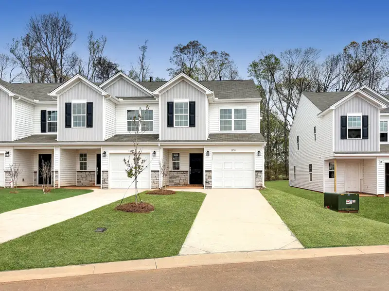 Front exterior of a new home in The Maple, Inman, SC, highlighting curb appeal (Image 1). Front exterior of a new home in The Maple, Inman, SC, highlighting curb appeal (Image 1).