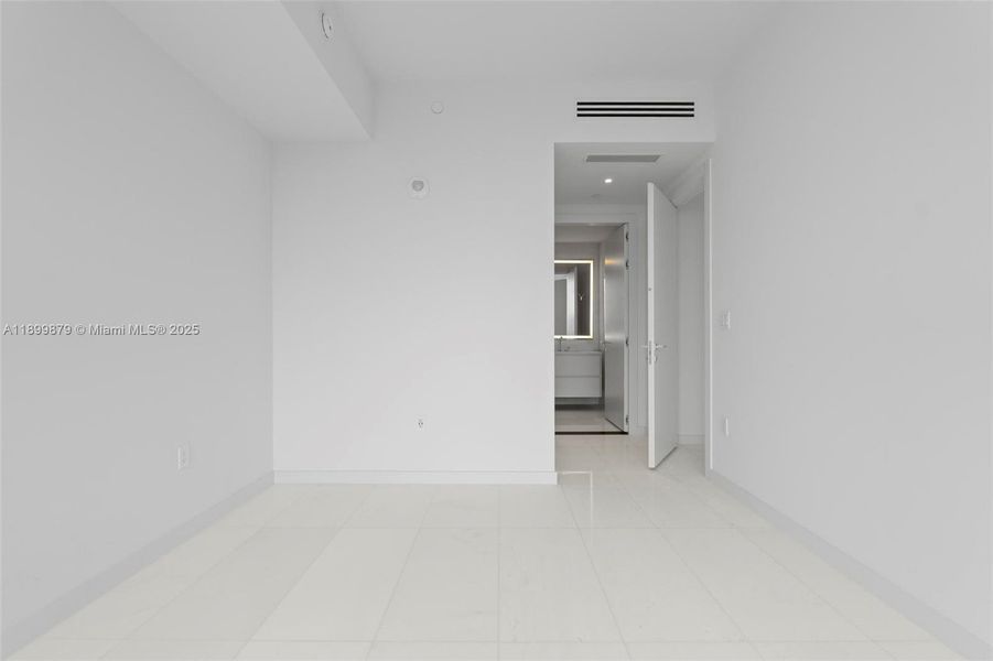 Spacious, unfurnished interior of a new home in Aston Martin Residences, Miami (Image 13).