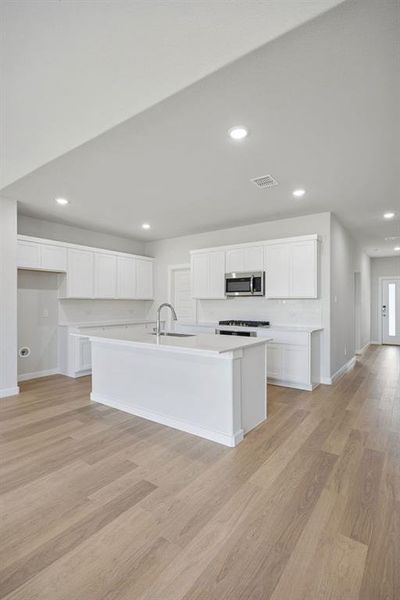 Kitchen in the Masters home plan by Trophy Signature Homes – REPRESENTATIVE PHOTO Kitchen in the Masters home plan by Trophy Signature Homes – REPRESENTATIVE PHOTO