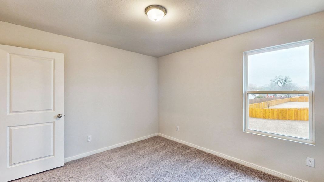 A room with a window and a door.