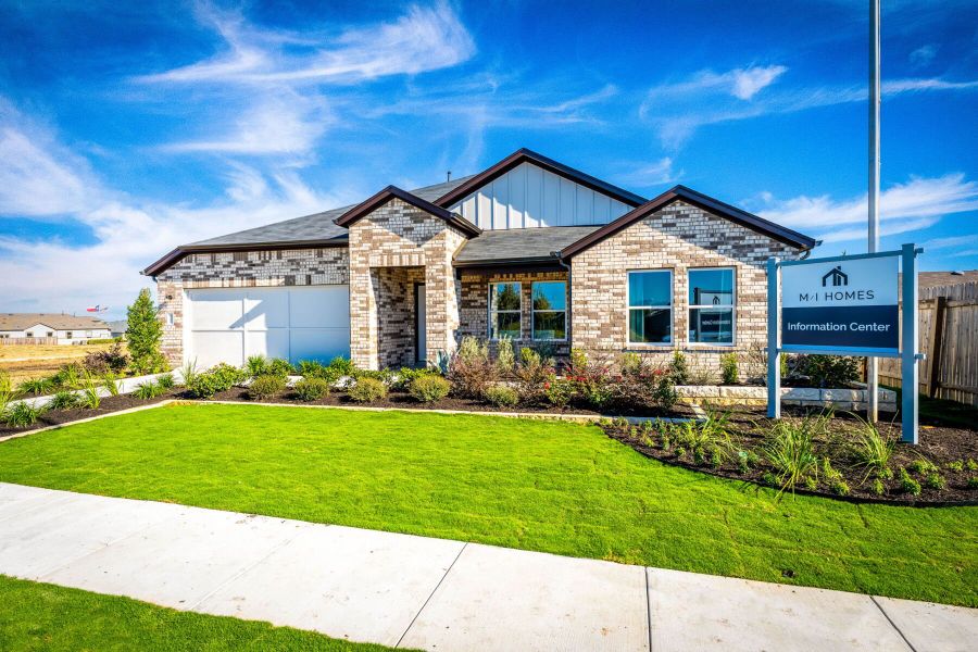 This is the front exterior of the Hawkins plan. This is the model home located in Carillon at 13305 Eppright Trace Blvd., Manor, TX This is the front exterior of the Hawkins plan. This is the model home located in Carillon at 13305 Eppright Trace Blvd., Manor, TX