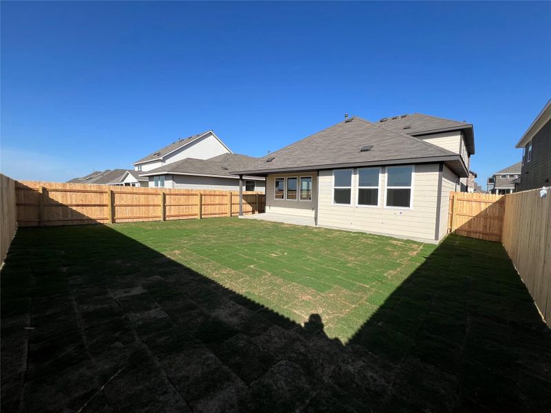 Exterior details and patio area of a home in Rolling Glen, Hutto (Image 21).