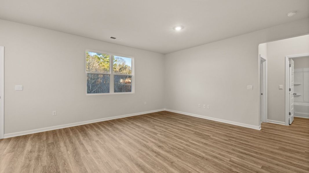 Representative unfurnished interior of a home built from the Hayden by D.R. Horton in Brooks Station, Dacula (Image 14).