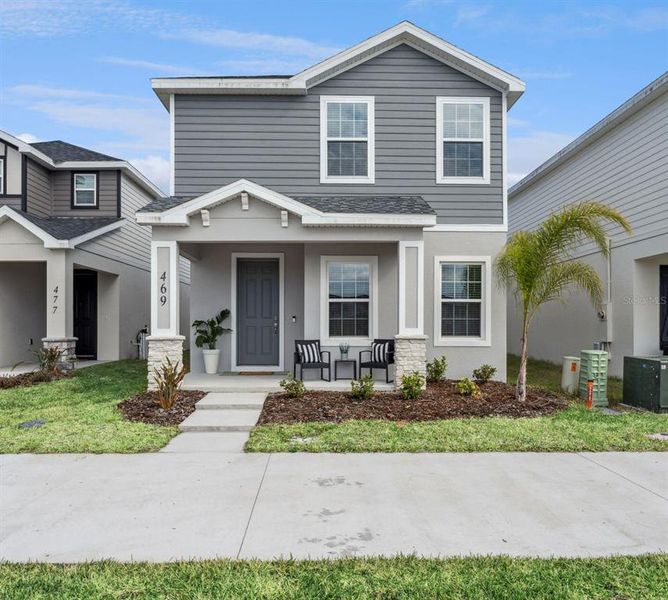Front exterior of a new home in , St. Cloud, FL, highlighting curb appeal (Image 2).