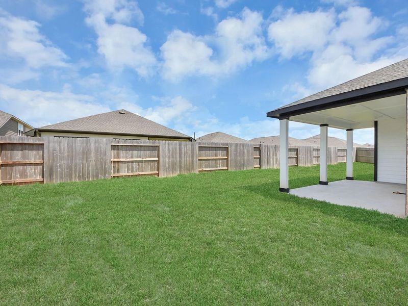 Exterior details and patio area of a home in Sunterra, Katy (Image 3).