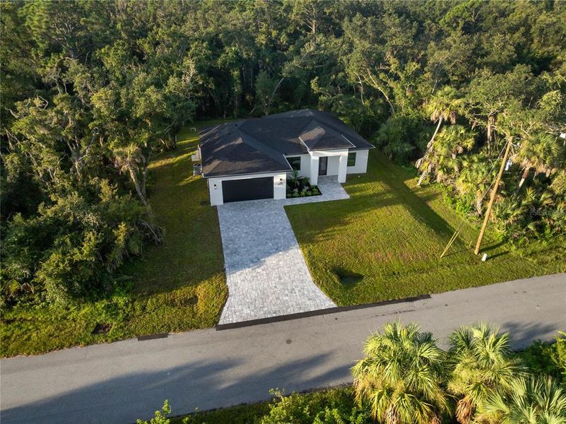 Front exterior of a new home in , Port Charlotte, FL, highlighting curb appeal (Image 25).