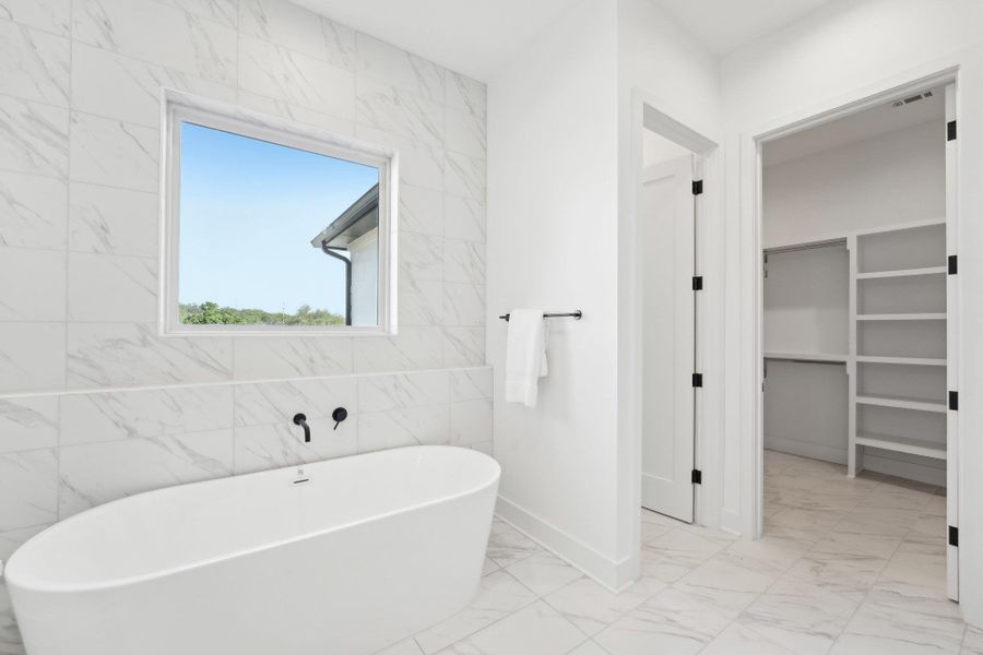 Elegant finishes and generous space define every bathroom in this home. Elegant finishes and generous space define every bathroom in this home.
