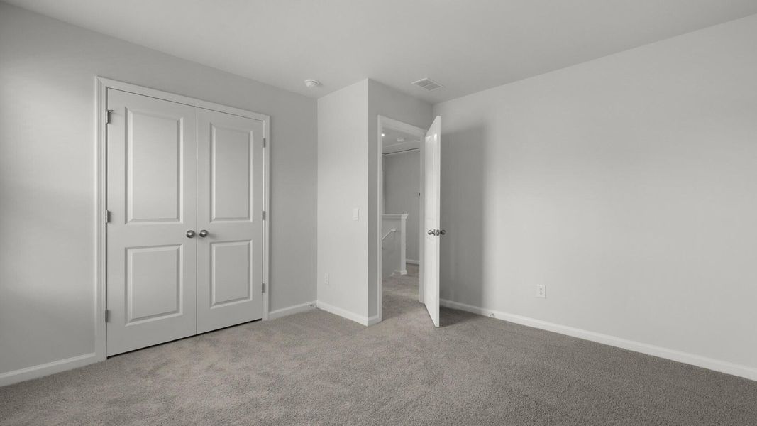 Spacious, unfurnished interior of a new home in Pine Hills Townhomes at Cane Bay, Summerville (Image 22).