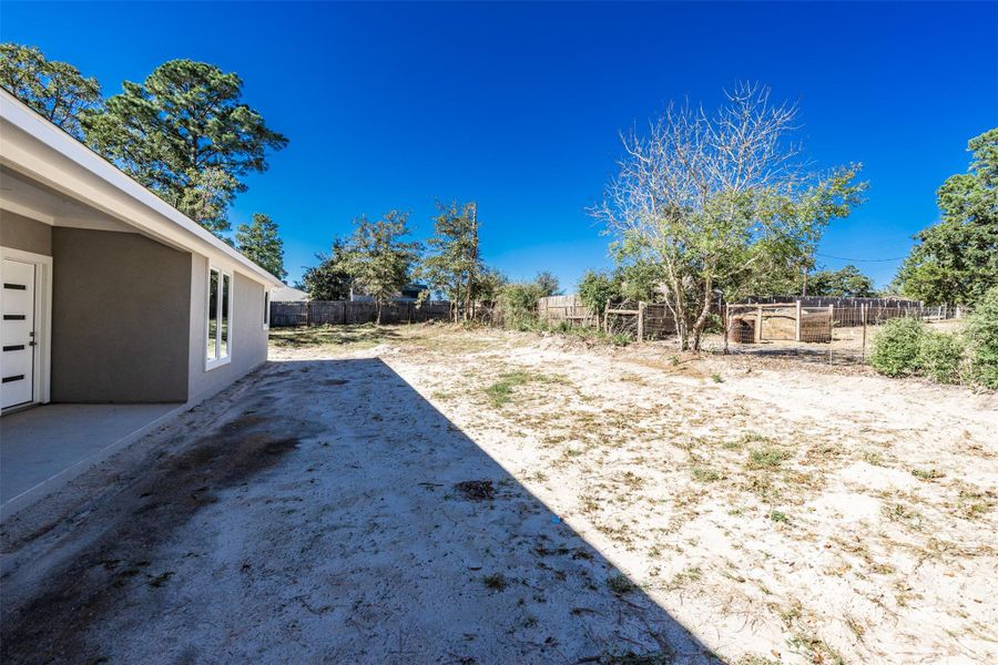 View of fenced backyard