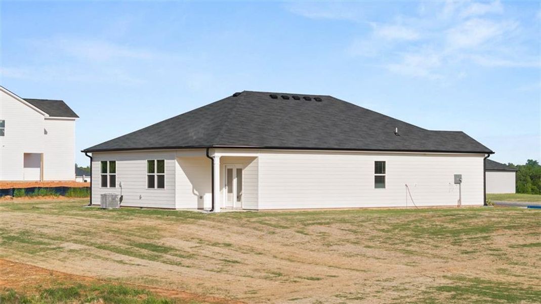 Front exterior of a new home in Champion's Run, Lithonia, GA, highlighting curb appeal (Image 26).