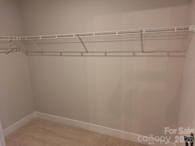 Primary Walk-In Closet Primary Walk-In Closet
