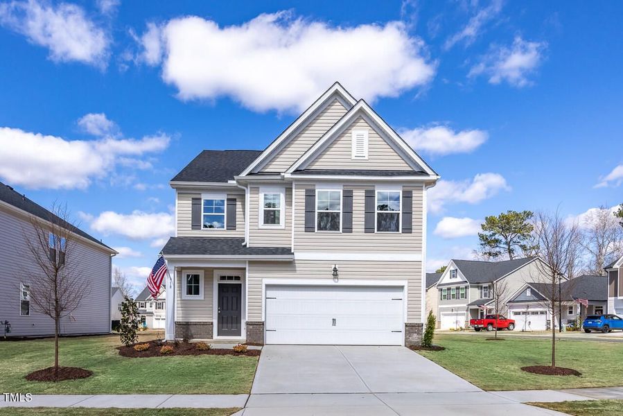 Front exterior of a new home in Gregory Village, Lillington, NC, highlighting curb appeal (Image 32). Front exterior of a new home in Gregory Village, Lillington, NC, highlighting curb appeal (Image 32).