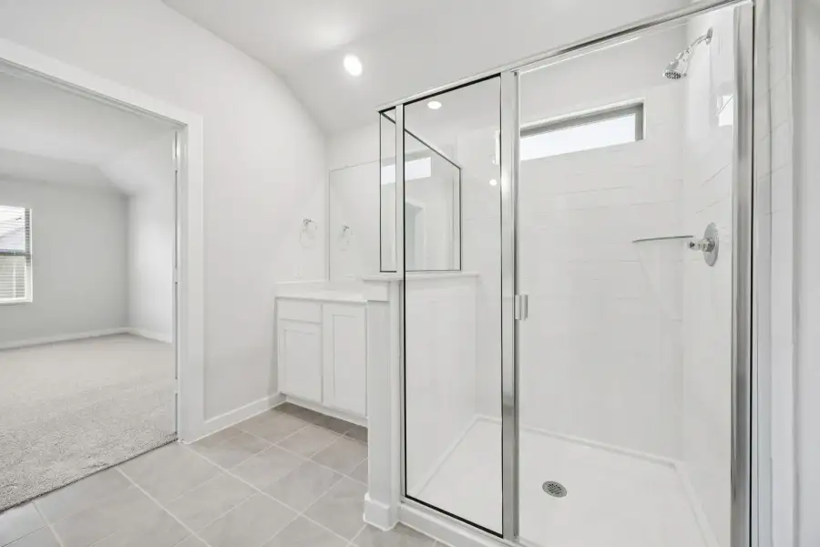Primary Bathroom in the Heisman home plan by Trophy Signature Homes – REPRESENTATIVE PHOTO