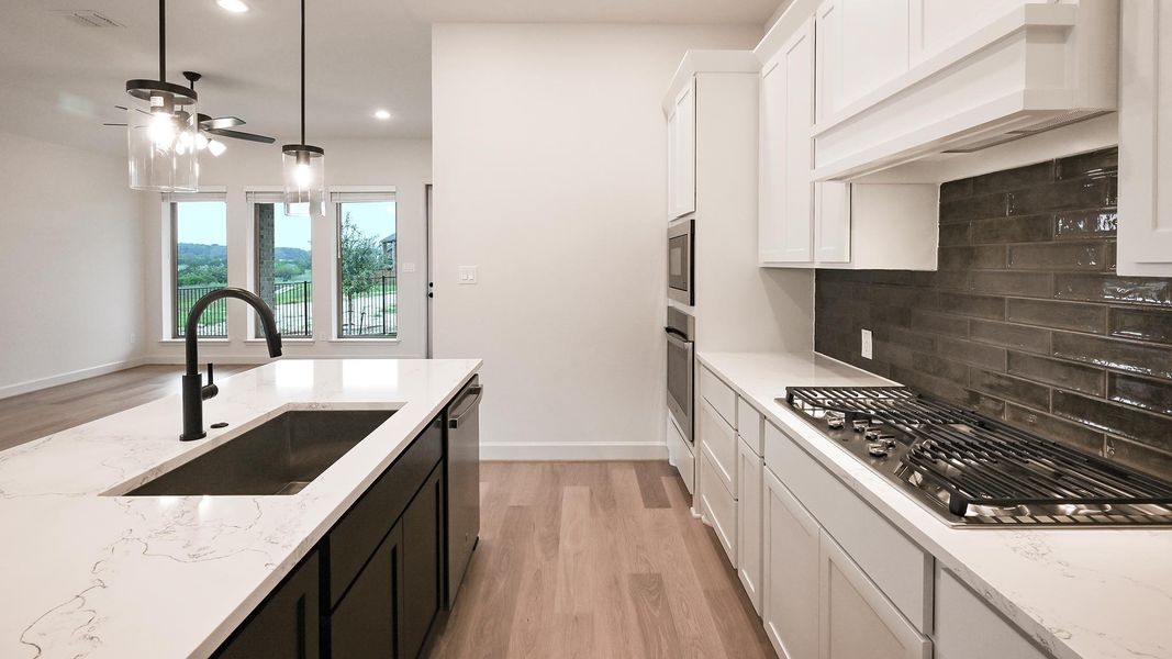 Furnished interior view inside a new home in 6 Creeks, Kyle (Image 12).