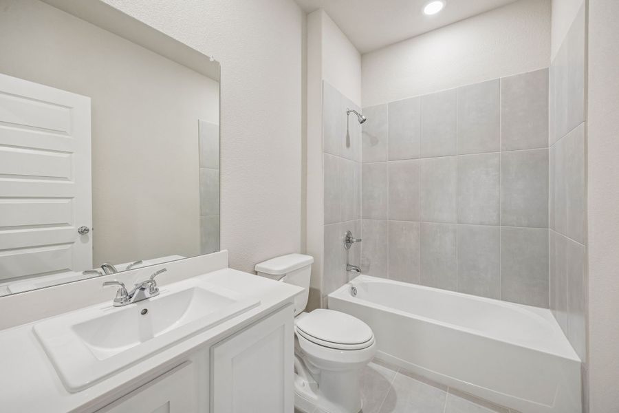 Bathroom in the Wimbledon home plan by Trophy Signature Homes – REPRESENTATIVE PHOTO