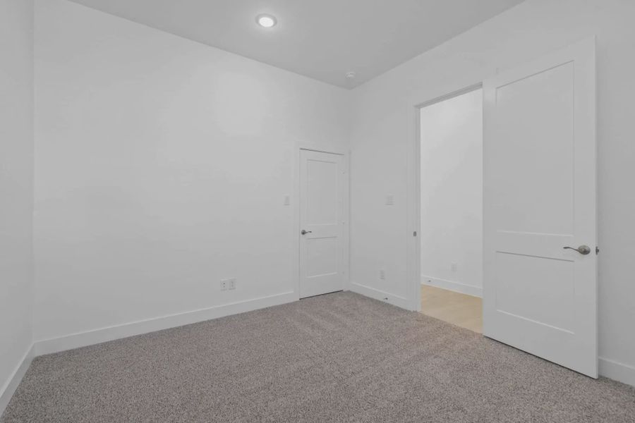 Representative unfurnished interior of a home built from the Waterford by Chesmar Homes in Meridiana 60's, Manvel (Image 42).