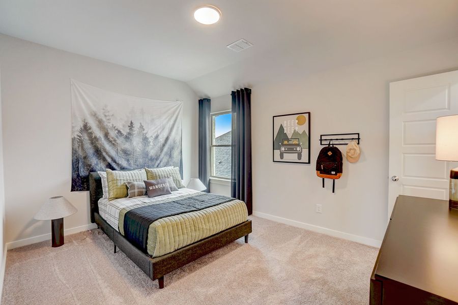 Bedroom in the Stanley II home plan by Trophy Signature Homes - REPRESENTATIVE PHOTO