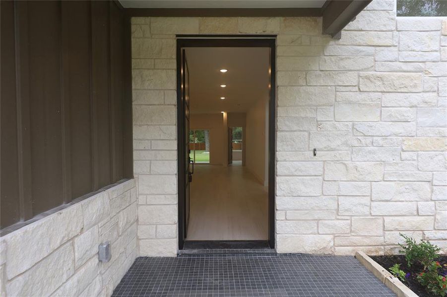 Doorway to property with a patio