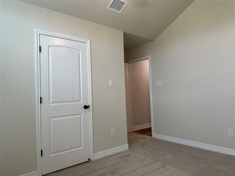 Unfurnished bedroom with carpet and baseboards Unfurnished bedroom with carpet and baseboards